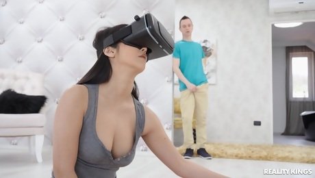 VR fantasy sex turns into reality once her stepbrother walks in on her