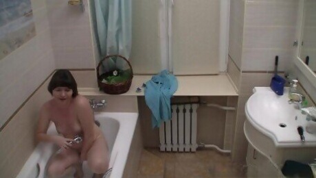 Solo teen masturbates in the shower