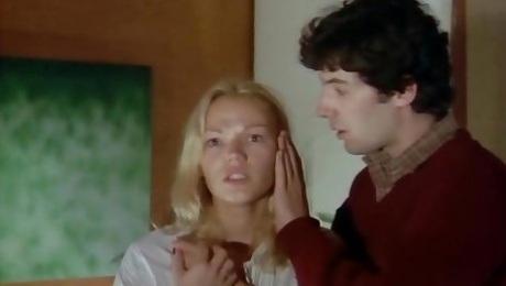 Dude lies down on Brigitte Lahaie to fill her slit with dick